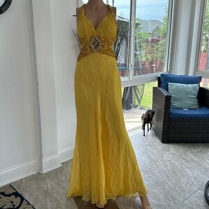 Yellow a cut dress with sequins on the chest and waist